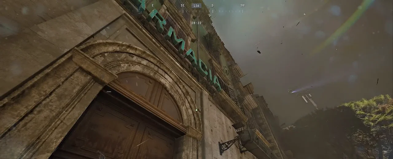 ARC Raiders Buried City building facade beneath a grey sky with airborne debris during a Hurricane raid.