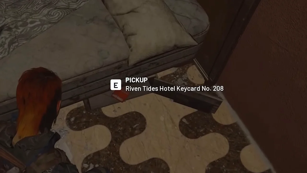 ARC Raiders Riven Tides red card beside a bed with the native PICKUP Riven Tides Hotel Keycard No. 208 prompt.